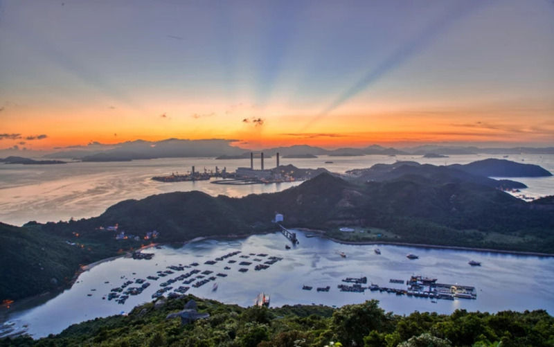 Hong Kong coastline at sunset during the boat trip